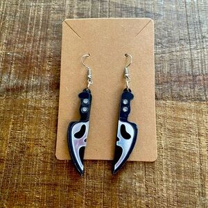 Ghost Face earrings.
